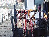 408 Muktinath Chumig Gyatsa Bells and Candles Next To Temple Entrance There was a hubbub of activity outside the Muktinath Chumig Gyatsa temple with the pilgrims lighting lamps outside the temple, ringing bells, and chanting. The Central Vishnu temple was build around 1815. Alas, I wasn't allowed to enter because I am not a Hindu.